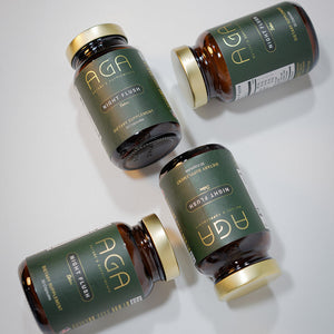 Four bottles of AGA supplements on a light gray background