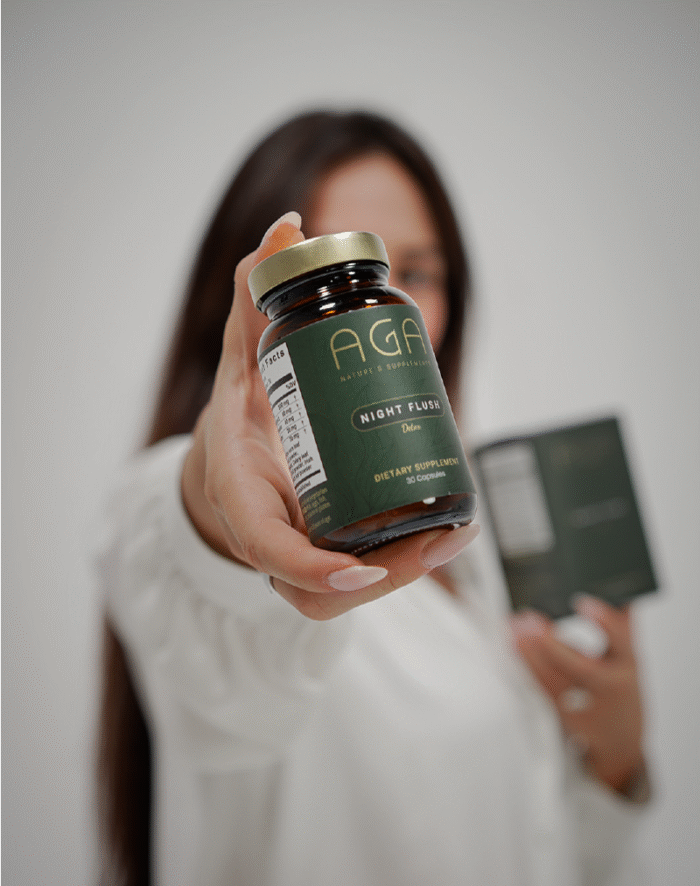Woman showing Night Flush Detox Supplement