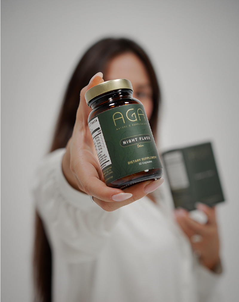 Woman showing Night Flush Detox Supplement