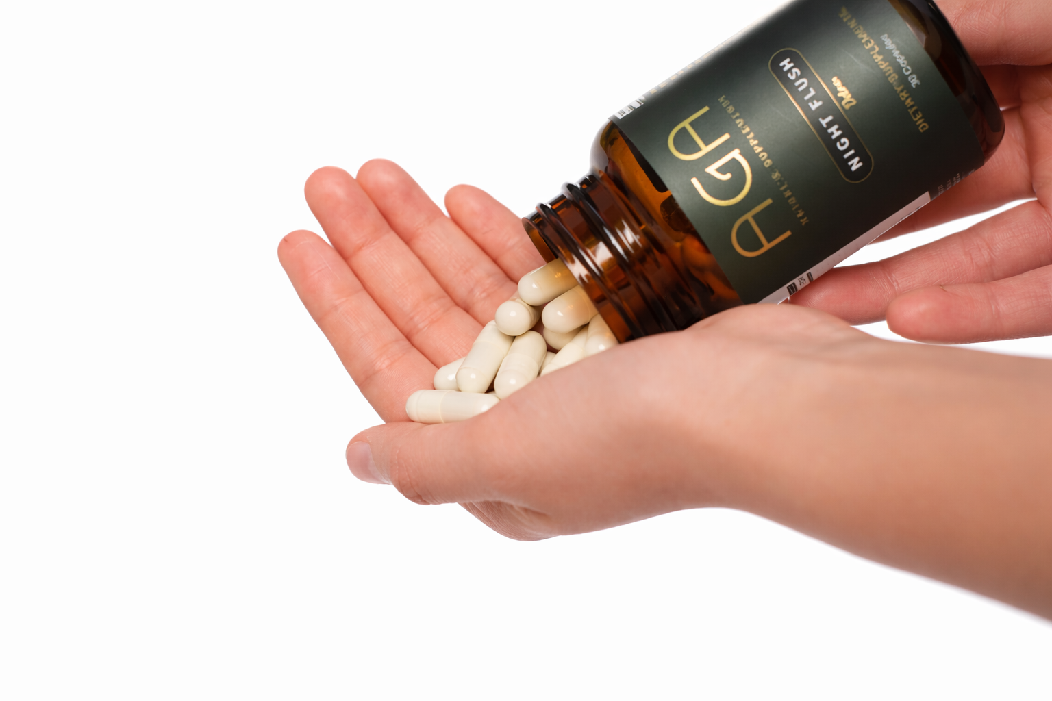 AGA Night Flush Supplement Capsules in Hand